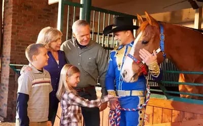 Family at the Horse Walk at the Stampede