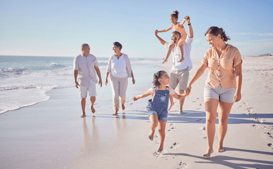 family walking on the beach