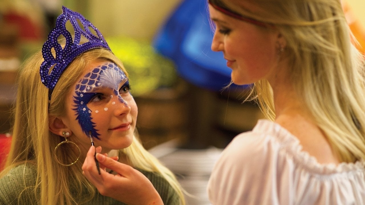 Young girl with face painted