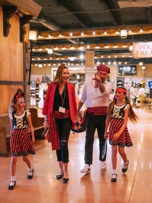 guests arriving in costume at Pirates Voyage