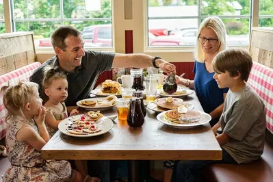 family eating breakfast at Frizzle Chicken Cafe