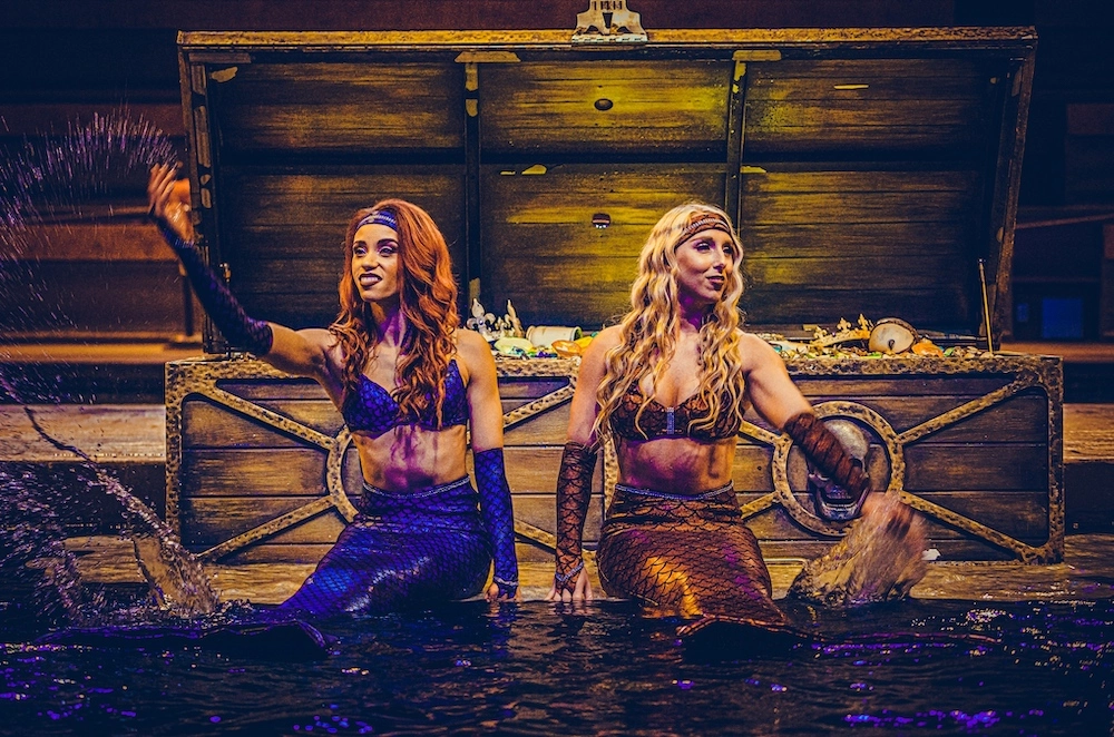 mermaids in the water at Pirates Voyage