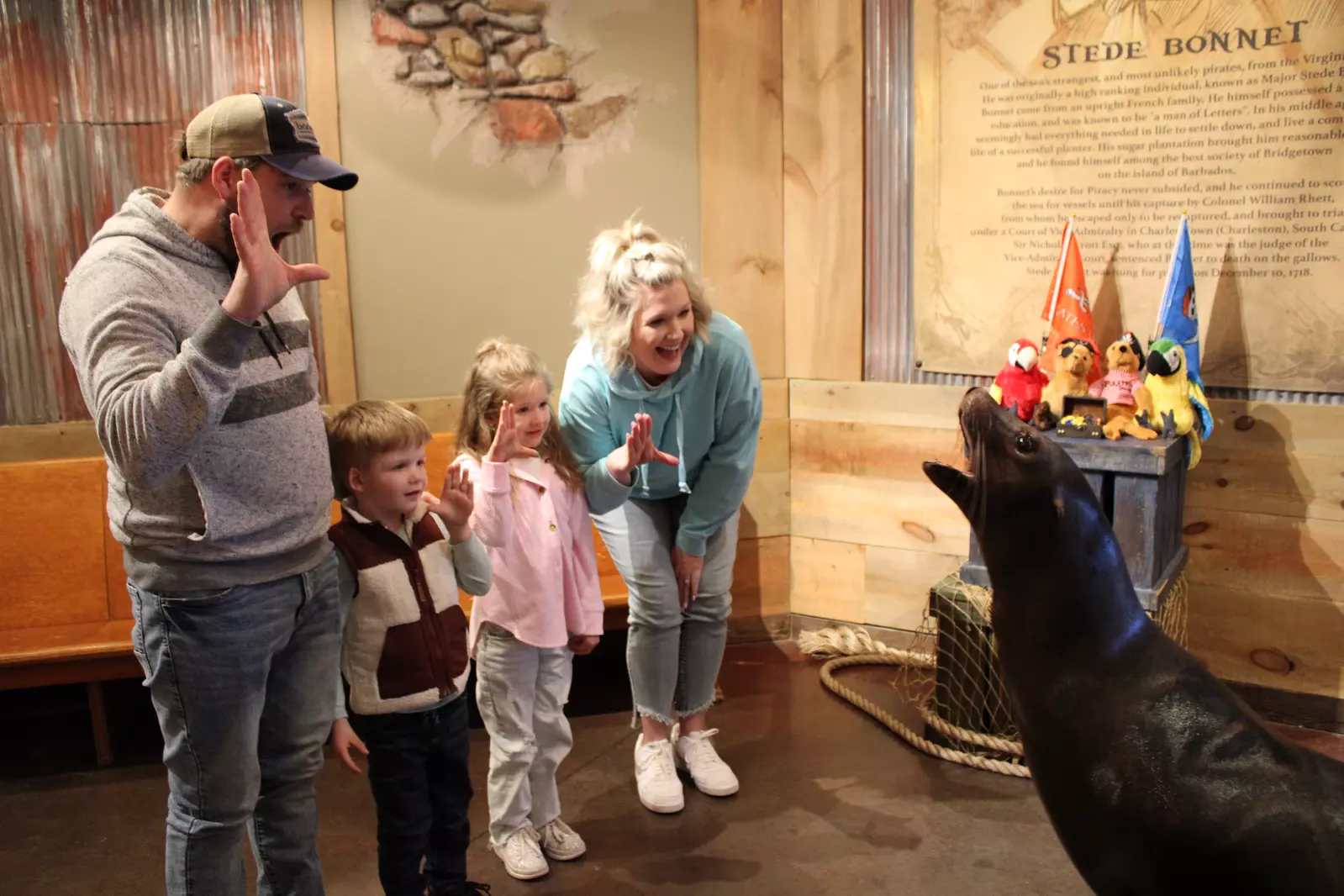 family interacting with Salty the Sea Lion