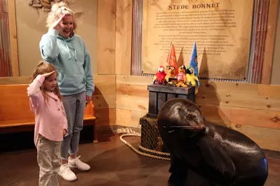 mom and daughter with sea lion at Animal Encounter