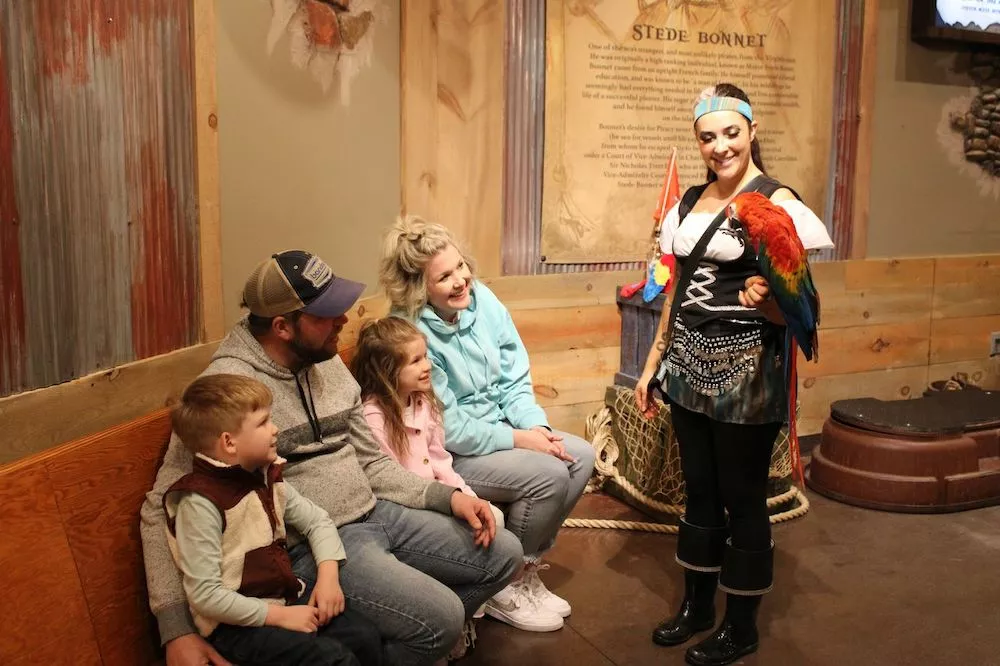 family with a bird at the animal encounter